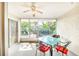 Inviting screened patio with a glass-top table and comfortable seating at 301 Pinebrook Club Dr # 1, Venice, FL 34285