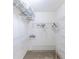 Walk-in closet featuring white walls, carpet, and metal racks at 301 Pinebrook Club Dr # 1, Venice, FL 34285