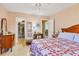 Cozy bedroom featuring a closet, terrazzo floors, and comfortable furnishings at 3151 Datura Rd, Venice, FL 34293