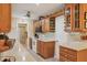Functional kitchen featuring wood cabinets, modern appliances, and ample counter space for cooking and meal preparation at 3151 Datura Rd, Venice, FL 34293