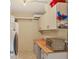 Functional laundry room with washer, dryer, storage cabinets, and a countertop at 3151 Datura Rd, Venice, FL 34293