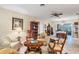Spacious living room featuring tile floors, a ceiling fan, and traditional furnishings creating a comfortable atmosphere at 3151 Datura Rd, Venice, FL 34293