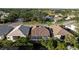 Aerial view showcasing homes in a quiet residential neighborhood at 320 Langholm Dr, Venice, FL 34293