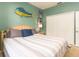 King-size bed in bright bedroom with double doors to exterior at 320 Langholm Dr, Venice, FL 34293