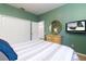 Bedroom with king bed, built-in shelving, and view to exterior at 320 Langholm Dr, Venice, FL 34293