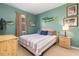 Guest bedroom with a queen bed and mounted TV at 320 Langholm Dr, Venice, FL 34293