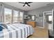 Bright bedroom with a king-size bed and access to the bathroom at 320 Langholm Dr, Venice, FL 34293