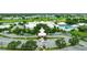Resort-style clubhouse with pool, parking and lush landscaping at 320 Langholm Dr, Venice, FL 34293