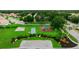 Aerial view of community playground with playset, basketball, and shuffleboard courts at 320 Langholm Dr, Venice, FL 34293