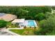 Community pool with pergola and surrounding landscaping at 320 Langholm Dr, Venice, FL 34293
