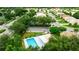 Aerial view of community pool and surrounding neighborhood at 320 Langholm Dr, Venice, FL 34293