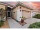 Front entrance and walkway leading to garage at 320 Langholm Dr, Venice, FL 34293
