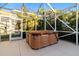 Enjoy this relaxing hot tub, covered by a screened lanai at 320 Langholm Dr, Venice, FL 34293