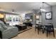 Spacious living area with large TV, comfortable seating, and dining space at 320 Langholm Dr, Venice, FL 34293