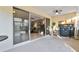 Bright screened porch with view of living room and backyard at 320 Langholm Dr, Venice, FL 34293