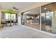 Spacious screened porch with view of kitchen and backyard at 320 Langholm Dr, Venice, FL 34293