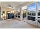 Enclosed porch with table, chairs, and view to backyard at 320 Langholm Dr, Venice, FL 34293