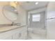 Updated bathroom with marble tile, new vanity, and bathtub at 324 Monet Dr, Nokomis, FL 34275