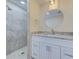 Modern bathroom with walk-in shower and updated vanity at 324 Monet Dr, Nokomis, FL 34275