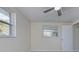 Bright bedroom with new flooring, fresh paint, and ceiling fan at 324 Monet Dr, Nokomis, FL 34275