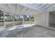 Spacious Florida room with screened windows and view of backyard at 324 Monet Dr, Nokomis, FL 34275