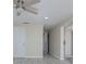 Bright hallway with ceiling fan and tile flooring at 324 Monet Dr, Nokomis, FL 34275