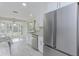 Modern kitchen with stainless steel appliances and white cabinets at 324 Monet Dr, Nokomis, FL 34275