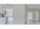 Open concept living room with view of kitchen and Florida room at 324 Monet Dr, Nokomis, FL 34275