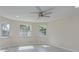 Bright living room featuring tile floors and multiple windows at 324 Monet Dr, Nokomis, FL 34275