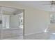 Open living room with sliding glass doors to the patio at 324 Monet Dr, Nokomis, FL 34275