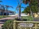 Private entrance to Golden Beach community with palm trees at 329 Coral St, Venice, FL 34285