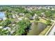 Aerial view of neighborhood with lake and homes at 335 Pembroke S Ln # 229, Venice, FL 34293