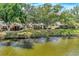 Aerial view of homes nestled along a tranquil canal at 335 Pembroke S Ln # 229, Venice, FL 34293