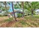Home exterior showcasing a tranquil backyard setting at 335 Pembroke S Ln # 229, Venice, FL 34293