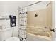 Bathroom with a tub and shower, featuring a nautical theme at 335 Pembroke S Ln # 229, Venice, FL 34293