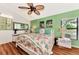 Bright bedroom with leafy green walls, and a large bed at 335 Pembroke S Ln # 229, Venice, FL 34293