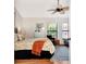 Bedroom with a queen bed and access to the patio at 335 Pembroke S Ln # 229, Venice, FL 34293