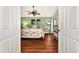 Main bedroom with leafy green walls and a coastal decor at 335 Pembroke S Ln # 229, Venice, FL 34293