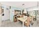 Coastal-themed dining room features a white table and light blue walls at 335 Pembroke S Ln # 229, Venice, FL 34293