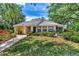 Single-story home with landscaped yard and walkway at 335 Pembroke S Ln # 229, Venice, FL 34293
