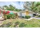 Single story home with attached garage and lush landscaping at 335 Pembroke S Ln # 229, Venice, FL 34293