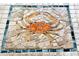 Tile floor with decorative crab mosaic at 335 Pembroke S Ln # 229, Venice, FL 34293