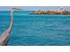 Great Blue Heron in front of ocean with people fishing at 335 Pembroke S Ln # 229, Venice, FL 34293