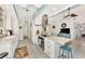 Modern kitchen with white cabinets, granite countertops, and island at 335 Pembroke S Ln # 229, Venice, FL 34293