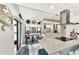 Bright kitchen with white cabinets, granite countertops, and stainless steel appliances at 335 Pembroke S Ln # 229, Venice, FL 34293