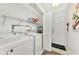 Laundry room with washer, dryer, and extra shelving at 335 Pembroke S Ln # 229, Venice, FL 34293