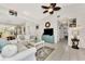 Bright and airy living room with white couches and coastal decor at 335 Pembroke S Ln # 229, Venice, FL 34293