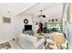 Open living area with white sofas and coastal decor at 335 Pembroke S Ln # 229, Venice, FL 34293