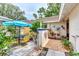 Outdoor patio with seating area and colorful plants at 335 Pembroke S Ln # 229, Venice, FL 34293