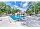 Inviting community pool with plenty of lounge chairs at 335 Pembroke S Ln # 229, Venice, FL 34293